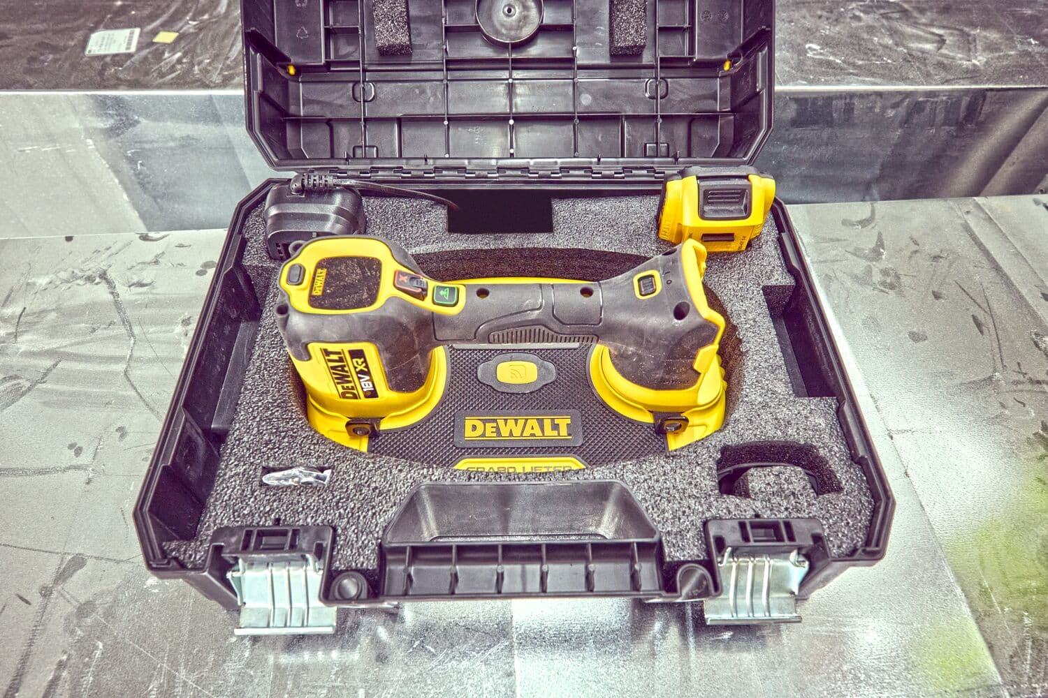 DEWALT DCE590 tool in a hard carrying case, with foam padding and accessories, viewed from above.